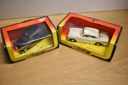 Corgi Die-casts, 279 Rolls-Royce Corniche, white with white interior, 425 Black Taxi, both in window