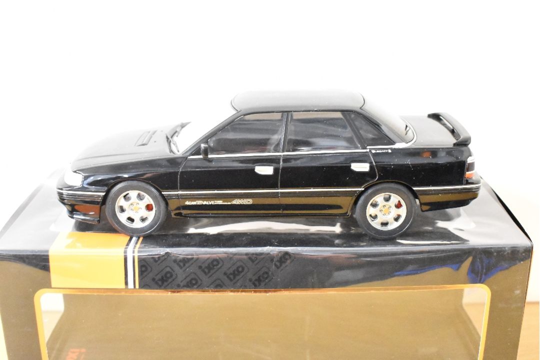 IXO 1:18 Scale Die-cast, 18CMC131A.22 Subura Legacy RS1991 Black, boxed with internal packaging - Image 1 of 4