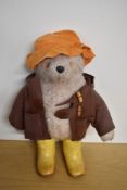 Gabrielle Bears 1972 Paddington Bear wearing orange hat, brown jacket and yellow Dunlop wellingtons,