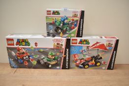 A group of three Lego Super Mario sets comprising Baby Mario vs. Baby Luigi model number 72034,