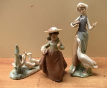 A group of three Lladro and Nao by Lladro porcelain studies comprising 'Girl Feeding Goose' model