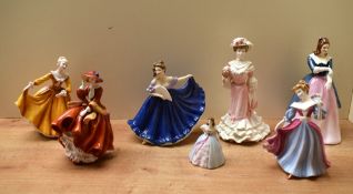 A group of five Royal Doulton bone china figurines comprising Figurine of the Year 2005 'Amy' HN