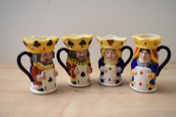 A group of four limited edition Royal Doulton bone china dual-faced character jugs comprising King