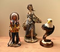 A large Capodimonte style figurine depicting a lady with floral baskets sold together with a