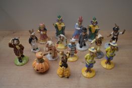 A group of sixteen Royal Doulton bone china Bunnykins studies to include 'Halloween Bunnykins' model