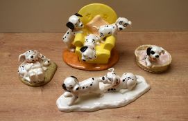 A group of four Royal Doulton bone china 101 Dalmatians series studies comprising 'Penny and
