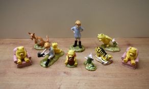 A group of nine Royal Doulton bone china Winnie the Pooh series figures to include 'Tiger Signs
