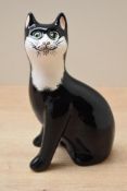 A Wemyss ware pottery black and white cat study, signed to base, measures 18cm tall, complete with