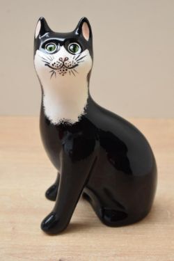 A Wemyss ware pottery black and white cat study, signed to base, measures 18cm tall, complete with