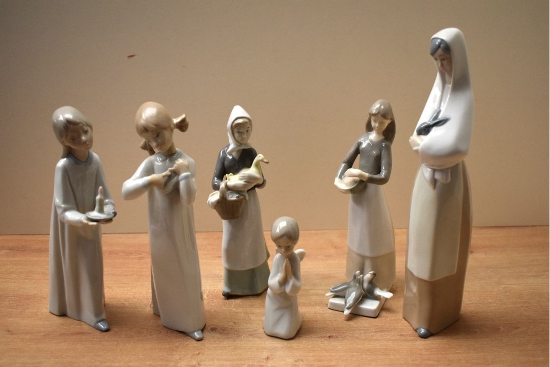 A group of six Nao by Lladro and similar porcelain figurines to include 'Girl Stretching' and ' - Image 1 of 4
