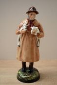 A Royal Doulton bone china figure 'Lambing Time' HN 1890, measures 23cm tall.