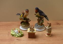 A group of three Beswick Pottery and Royal Albert Beatrix Potter characters comprising 'Tom