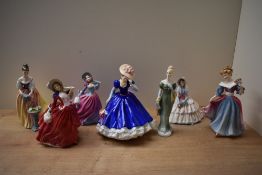 A group of seven Royal Doulton bone china figurines comprising 'Autumn Breeze' HN 4716, '