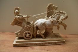 A 20th century reproduction resin figure group depicted a Roman chariot with a gladiator or