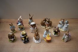 A group of twelve Royal Albert Beatrix Potter characters including 'Pigling Eats his Porridge', '