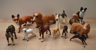 A group of eleven Beswick Pottery and similar animal studies to include 'Fox' (Standing) model