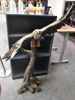 A large metal and resin bald eagle study posed with spread wings,measuring 162cm x 115cm, detachable