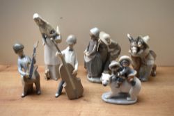 A group of six Lladro porcelain figurines to include 'Eskimo Riders' model number 5353, 'Boy with