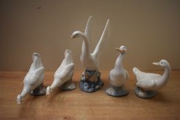 A group of five Nao by Lladro porcelain bird studies to include 'Swan taking flight' having a