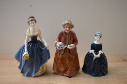A group of three Royal Doulton bone china figurines comprising 'Teatime' HN 2255, 'Cherie' HN 2341