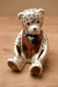 A Royal Crown Derby bone china 'Teddy Bear' paperweight, featuring Imari style decoration, having