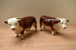 Two Coopercraft pottery Hereford cattle studies, comprising bull and cow, both in brown and white