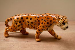 A Beswick Pottery 'Leopard' study model number 1082, designed by Arthur Gredington, in golden