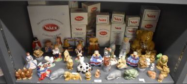A large selection of Wade English porcelain whimsies and similar to include 'Peter Pan', '
