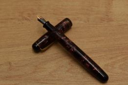 A Parker Televisor button fill fountain pen in Red Hatched with three cap bands having Parker