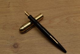 A Wahl Eversharp Skyline lever fill fountain pen in Black with Gold plated cap having Eversharp