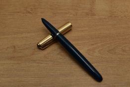 A Parker 51 Aerometric fill fountain pen in Teal Blue with rolled gold converging lined cap. Circa