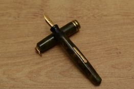 A Wahl Lady lever fill fountain pen in Green and Gold Marble with two narrow cap bands to ring top