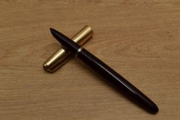 A Parker 51 Aerometric fill fountain pen in Burgundy with gold filled converging lined cap. Circa