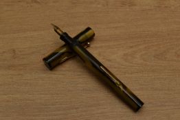 A Banker lever fill fountain pen in Green and Black having Banker 14K Gold Plated nib. Circa 1935.