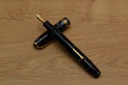 A Conway Stewart 58 lever fill fountain pen in Blue Marble with two narrow and one broad cap band