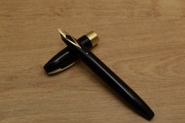 A Sheaffer Pen For Men III snorkel fill fountain pen in Black with gold trim having Sheaffer 14k