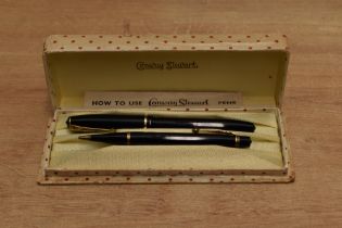 A boxed Conway Stewart 15 lever fill fountain pen and Nippy No3 pencil set in Black with single