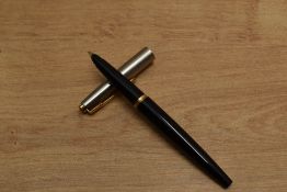 A Parker 45 cartridge fill in Black with lustraloy cap with gold trim. Circa 1960