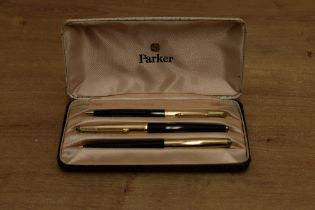 A boxed Parker 61 Custom Insignia capillary fill fountain pen, ballpoint pen and pencil set in Black
