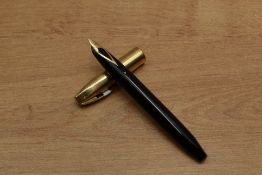A Sheaffer Pen For Men V snorkel fill fountain pen in Black with Gold Fill cap having Sheaffer 14K