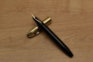 A Sheaffer Pen For Men V snorkel fill fountain pen in Black with Gold Fill cap having Sheaffer 14K