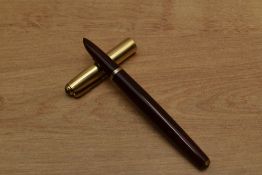 A Parker 51 vacumatic fill fountain pen in Cordovan Brown, twin jewel with gold filled fine line and