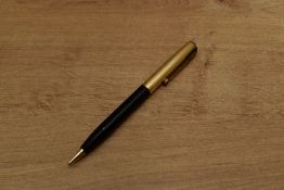 A Parker 51 pencil in Black with gold filled fine parallel lined cap. Circa 1955