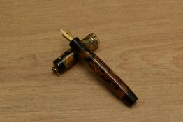 A Parker Duofold Streamlined Vest Pocket button fill fountain pen in Pearl and Black with three