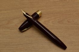 A Sheaffer Pen For Men III Snorkel fill fountain pen in Burgundy with gold trim having Sheaffer