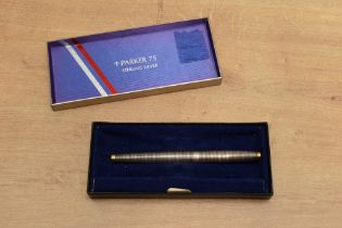 A boxed Parker 75 cartridge fill fountain pen in Sterling Silver with gold trim having a Parker