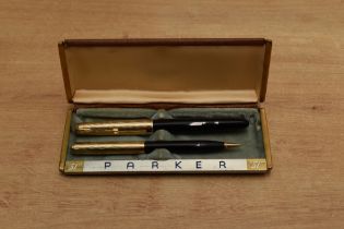 A boxed Parker 51 vacumatic fill fountain pen and Pencil set in Cordovan Brown with Gold Fill