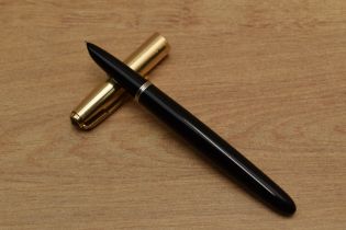 A Parker 51 aerometric fill fountain pen in Black with Gold Fill converging line cap. Circa 1950