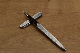 A Waterman converter fill fountain pen in nickel plated Moire pattern having 18K 750 nib. Circa