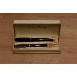 A boxed Parker Victory MK3 button fill fountain pen and pencil set in Black with two narrow bands to
